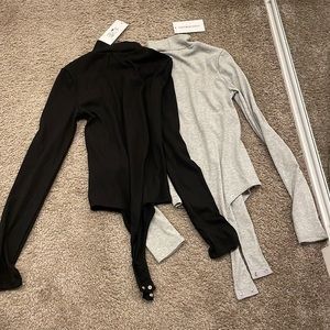 Black and heather grey thong long sleeved body suits